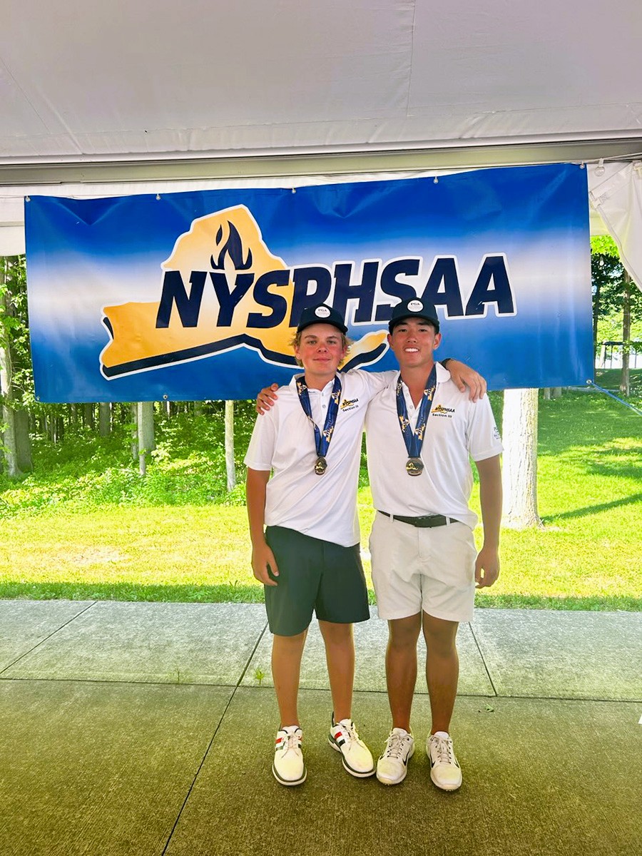Brayden Thomas and David Ahn pose with medals.