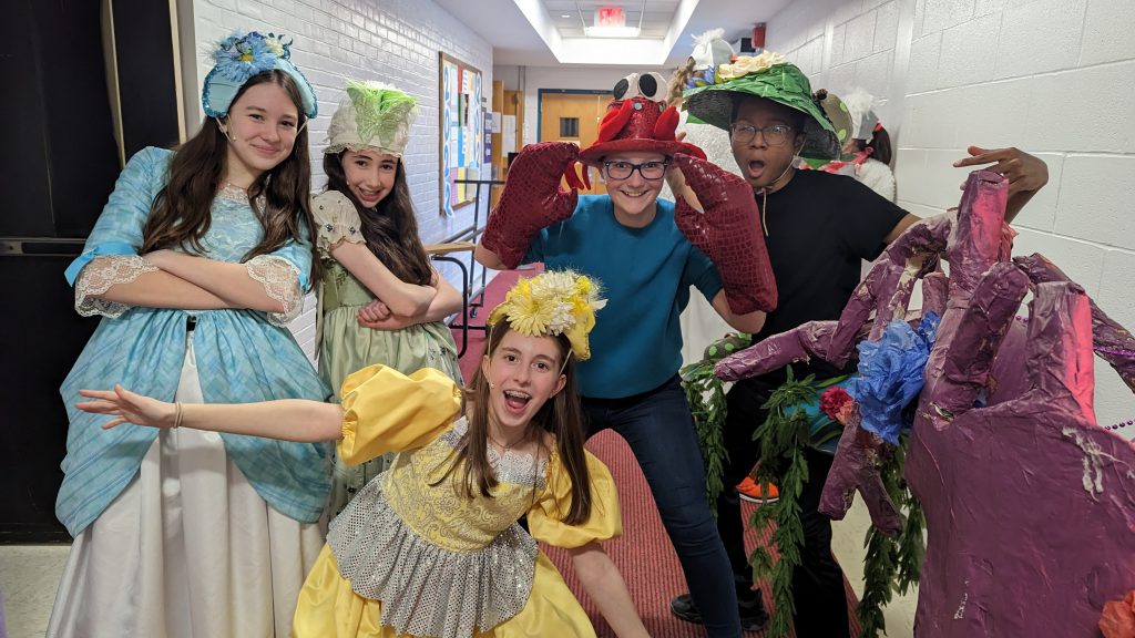 Image of "The Little Mermaid Jr." cast behind the scenes.