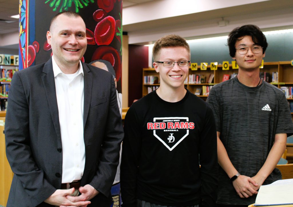 Photo of Principal Greg Lawson and J-D seniors Aaron Sikora and Frank Wang. 