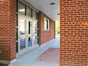 Photo of the front entrance to Moses DeWitt Elementary School. 