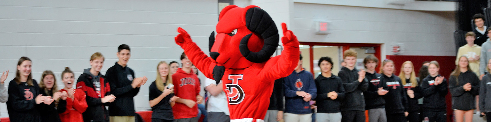 Image of Red Ram mascot at pep rally.