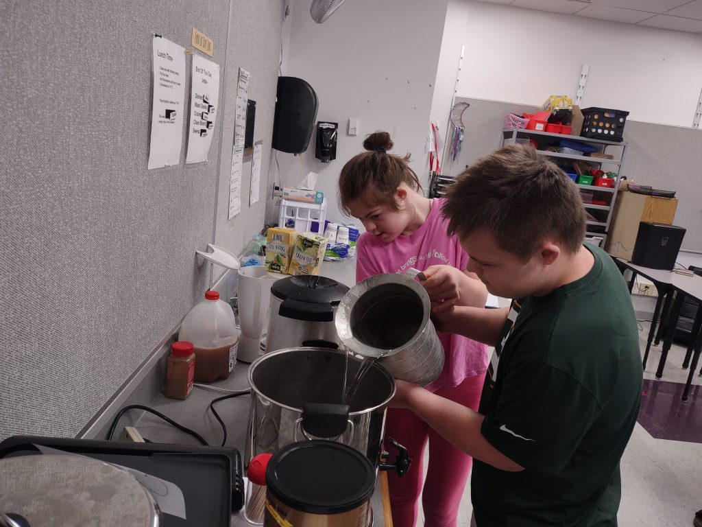 Image of students making coffee.