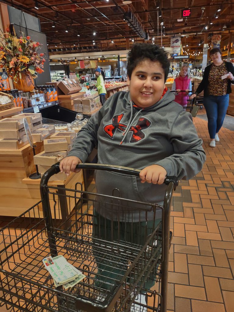 Image of student at grocery store.
