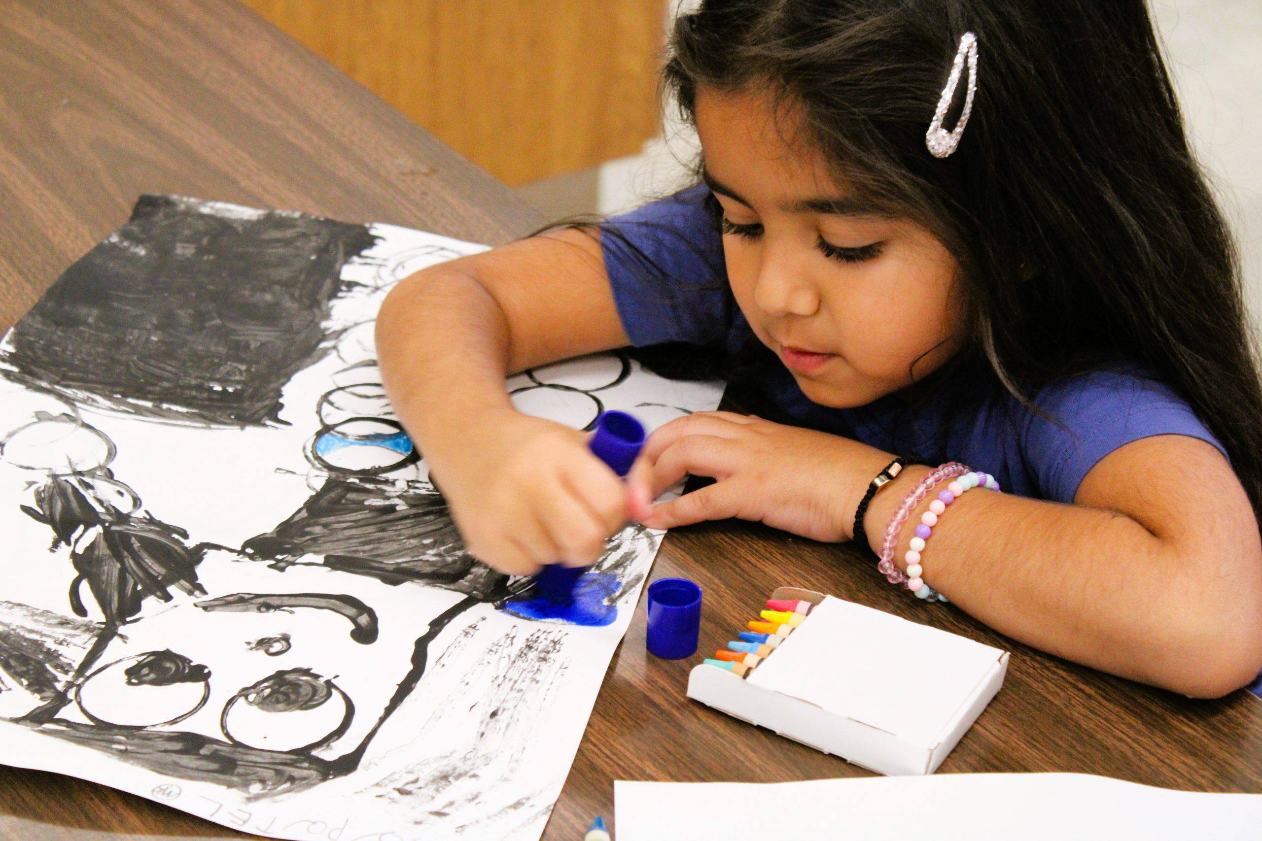 Image of student in art class.