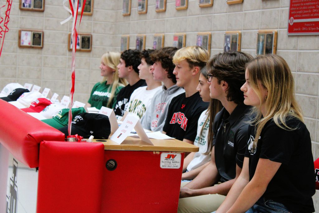 Image of J-D students preparing to sign letter of intent.