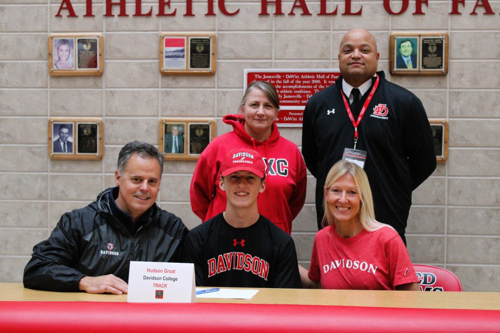 Image of Hudson Groat signing letter of intent for Davidson College, Track.