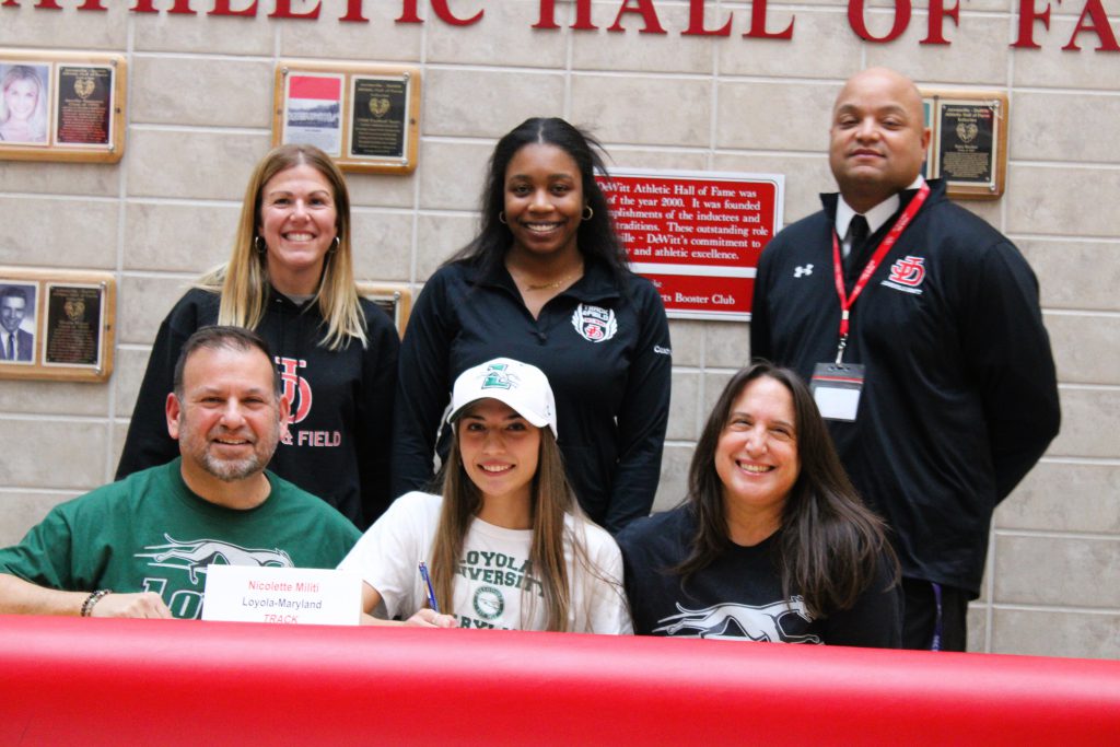 Image of Nicolette Militi signing letter of intent for Loyola-Maryland, Track.
