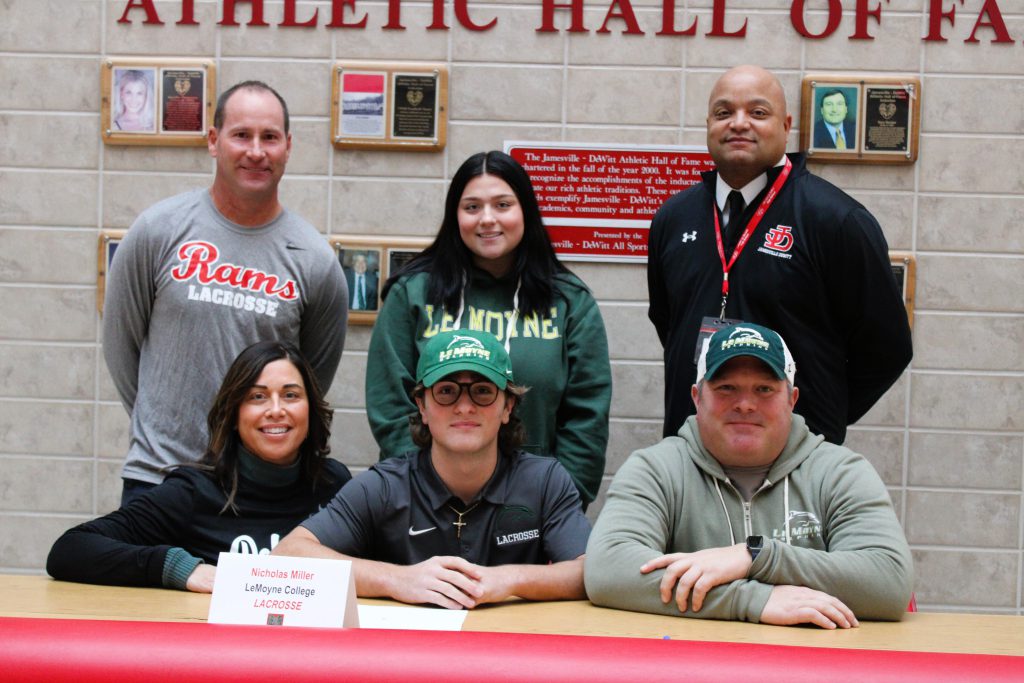 Image of Nick Miller signing letter of intent for LeMoyne College, Lacrosse.