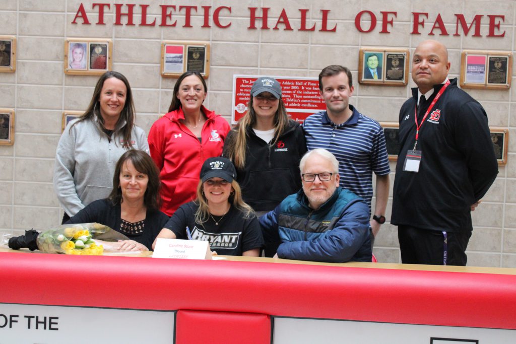 Image of Caroline Stone signing letter of intent for Bryant & Stratton College, Lacrosse.