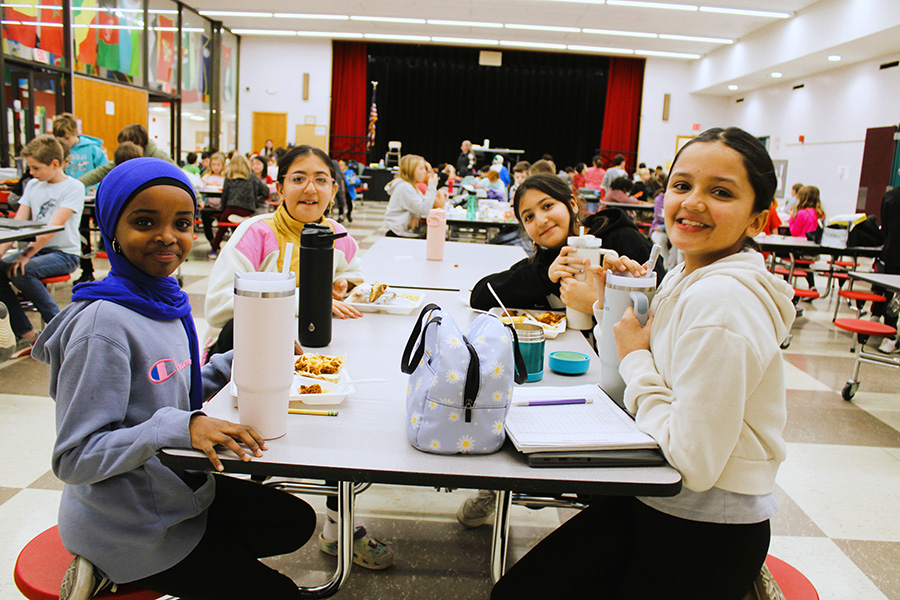 Image of students at lunch table.