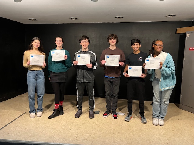 Image of students who participated in the Shakespeare Monologue School-Level Competition. Students photographed include: Alex Bronchetti, Lindsay Gaines, Yavuz Damkaci, Eden Shirilan-Howlett, Karunmay Aggarwal, and Rozir Kirkland.
