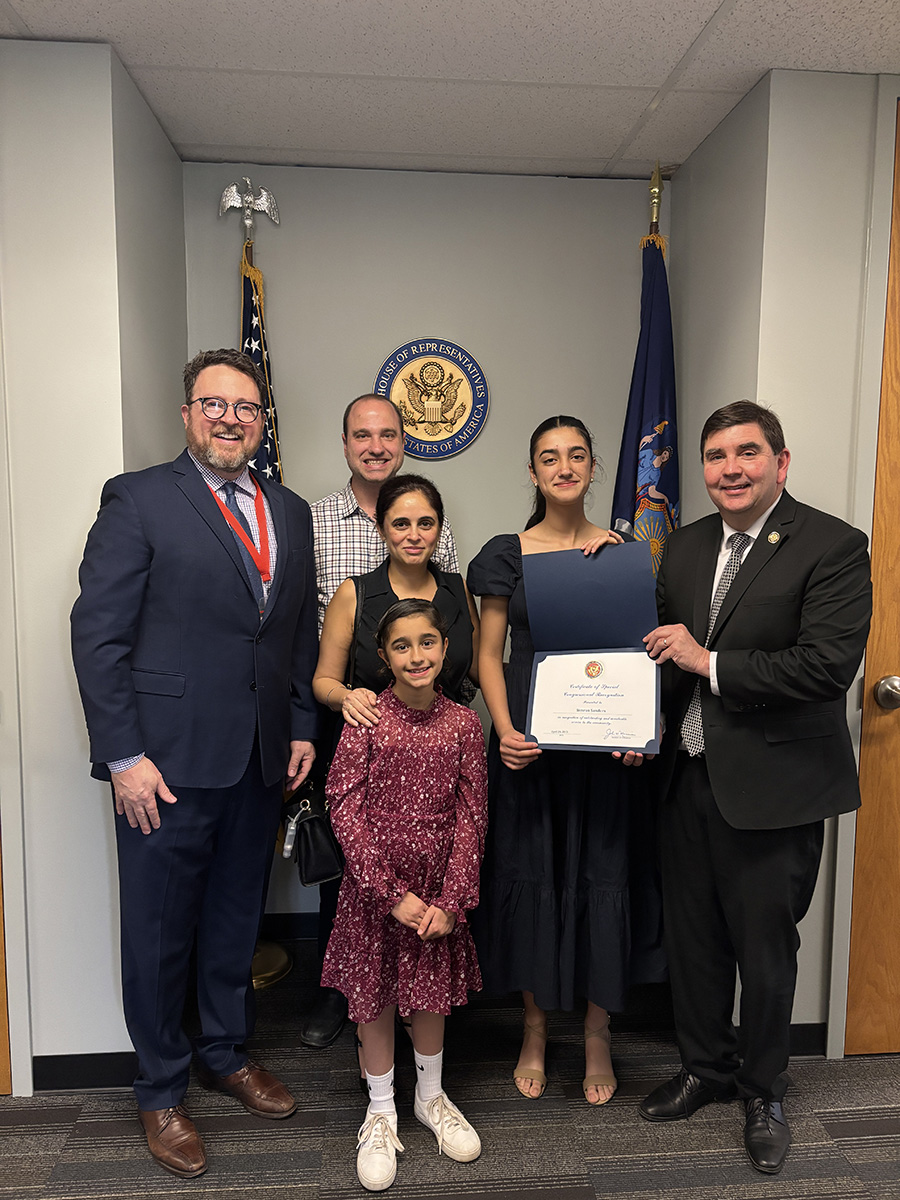 J-DMS student Simran Sanders and family pose for photo with Rep. Mannion.