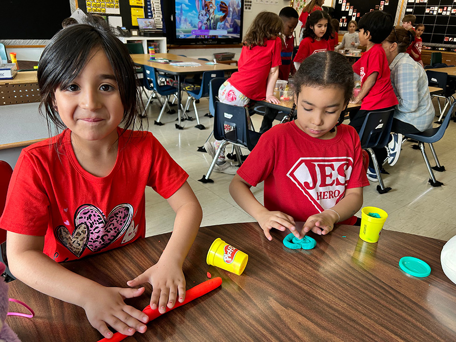 JES students play with play doh during Global Play Day.