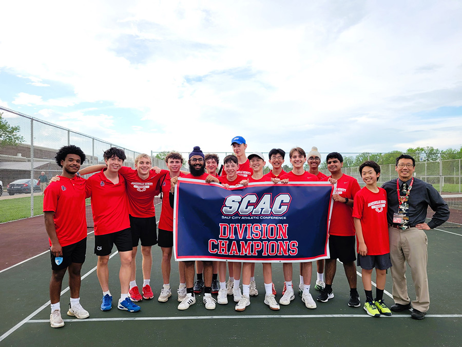 J-DHS Tennis pose with League Champs 2025 banner.