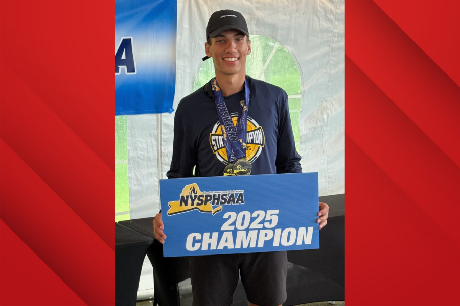 J-DHS golfer Jackson Saroney poses with 2025 NYSPHAA state champion banner.