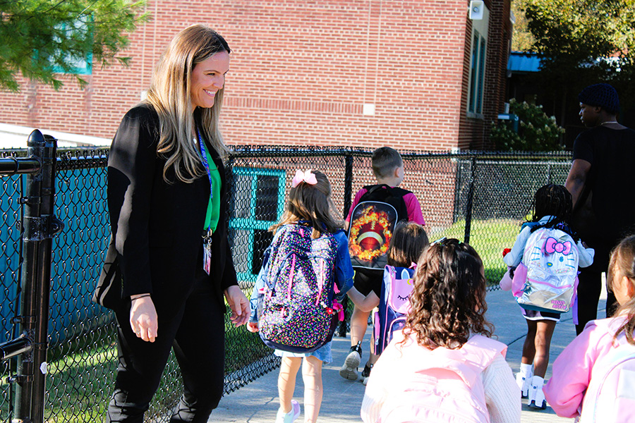 Principal Victoria Lee welcomes students on the first day of school.