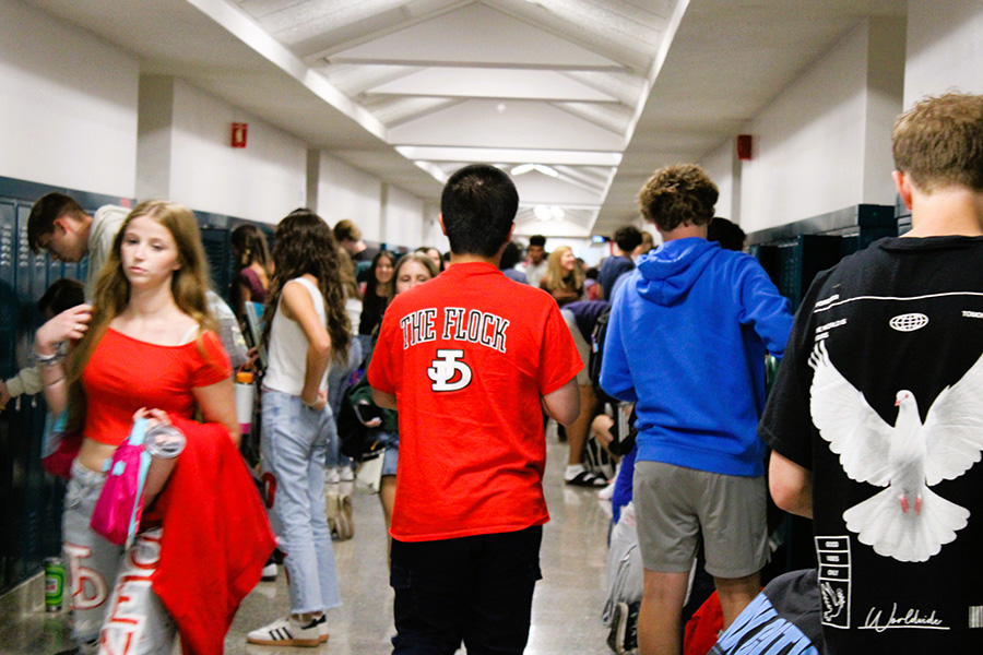 Busy hallway with students visiting lockers.