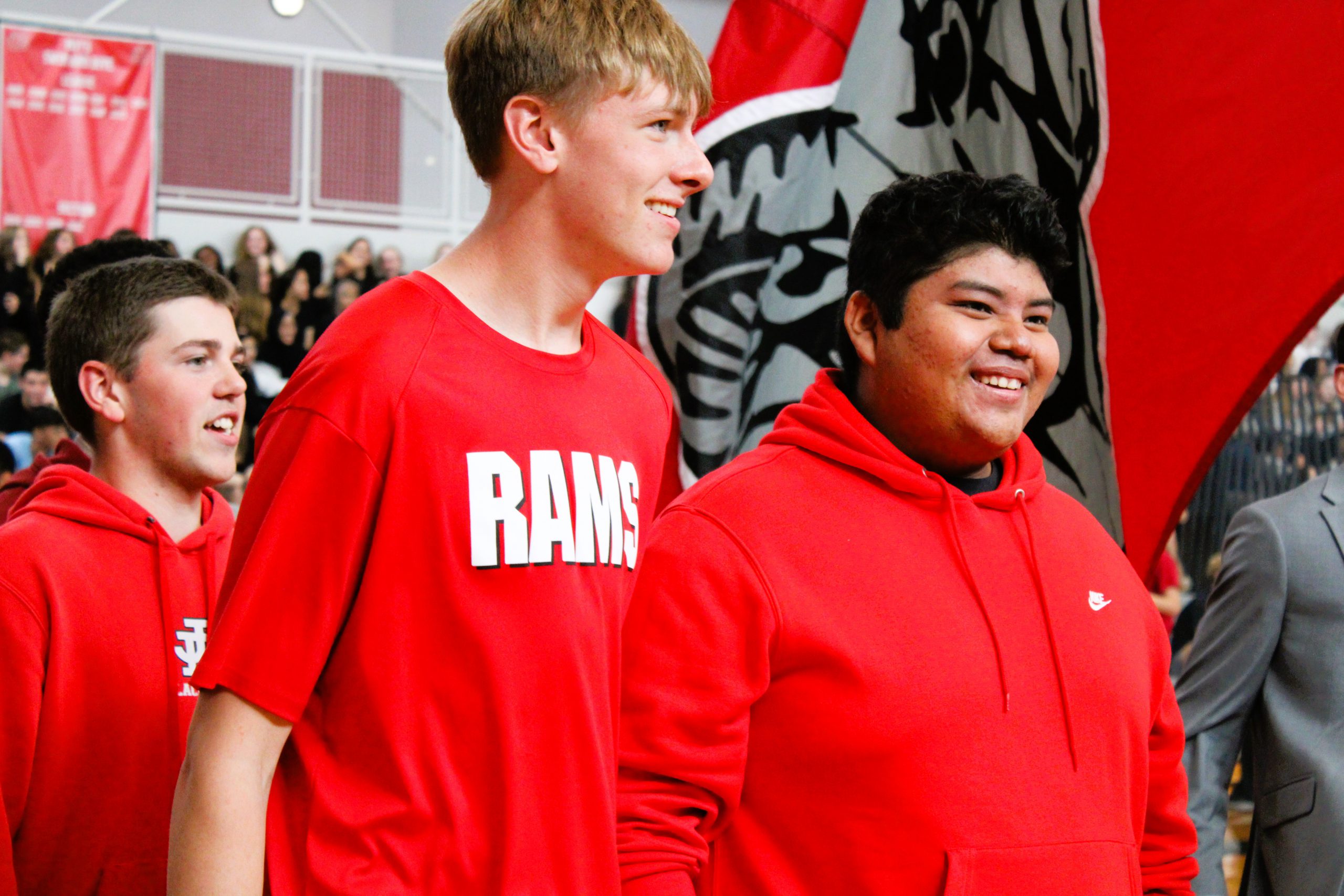 J-D High School seniors walk into pep rally with battle flag.