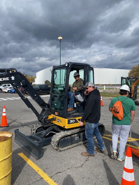 Student sits in forklift