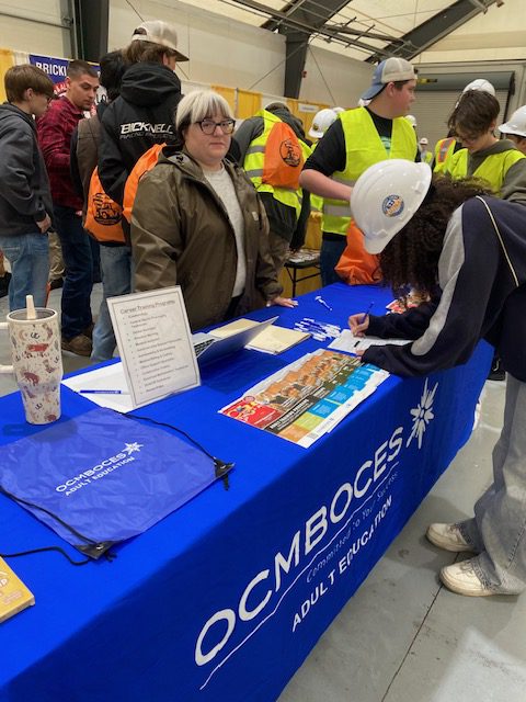 Student checks out informational booth.