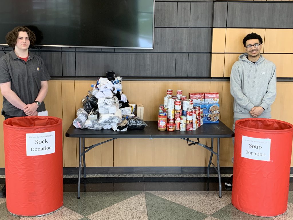 High School Band members Gabriel Lewis (Class of ‘27) and Maxwell Dziedzic (Class of ‘27) organizing the donations.