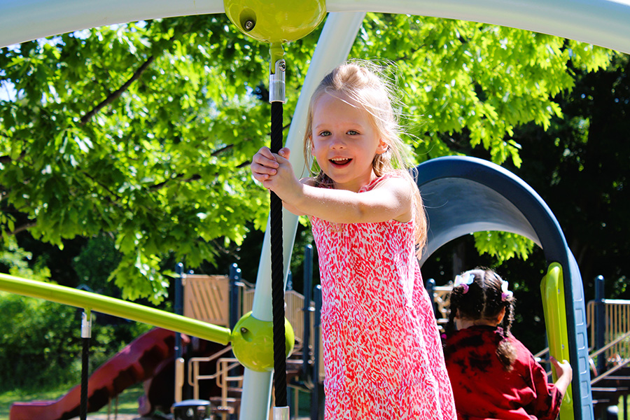 Student plays on playground.