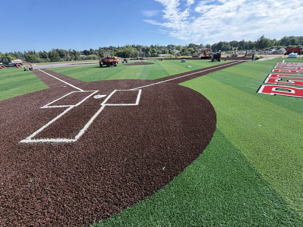 Close up of new turf being installed at Lyndon Field.