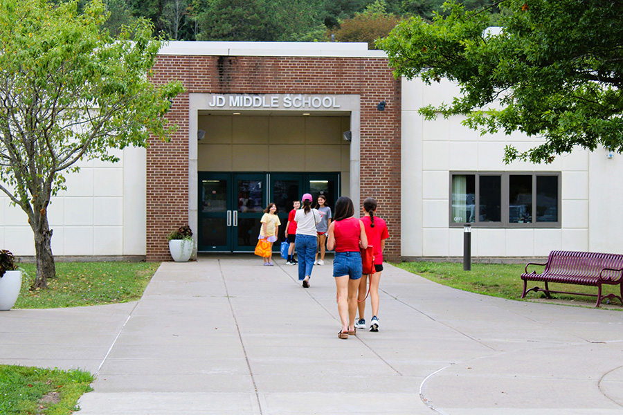 Families walk into school.