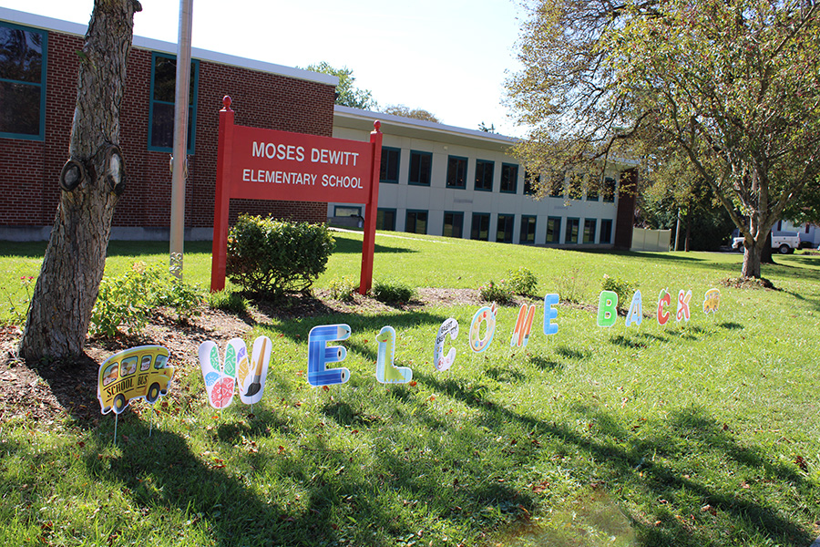 Welcome back sign outside Moses DeWitt.