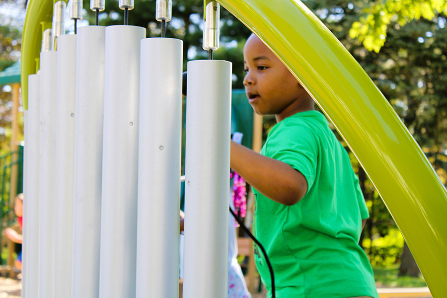 Student plays on playground.