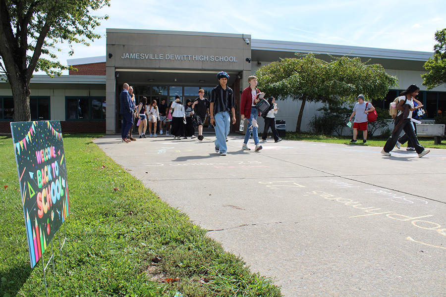 Students walk out of high school.